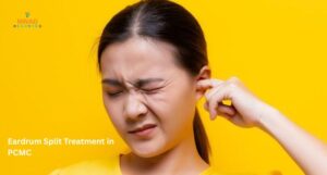 ENT doctor examining ruptured eardrum